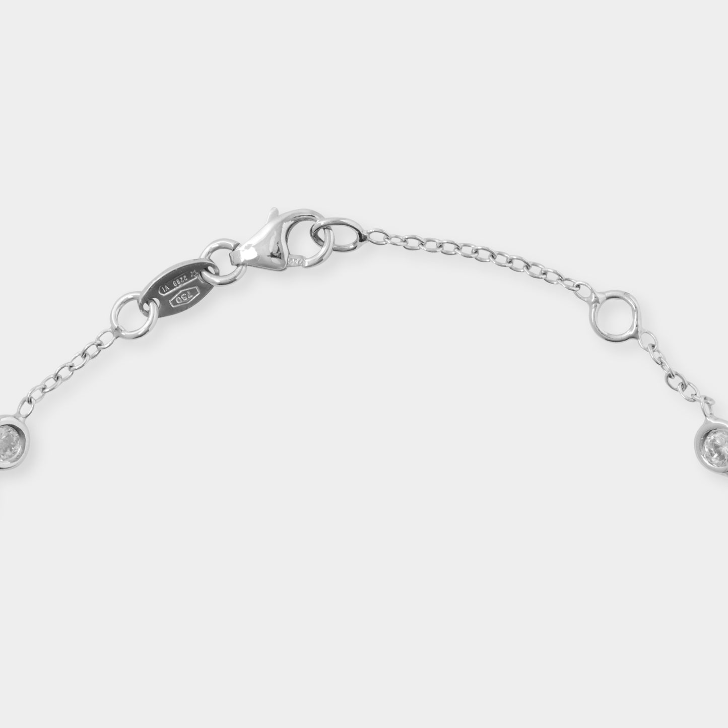 18 K White Gold loop chain and White Sapphire